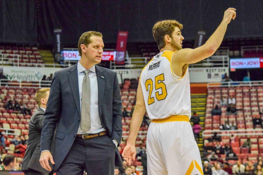 NKU head coach John Brannen talks to Cole Murray during Sundays Horizon League tournament quarterfinal against Wright State.