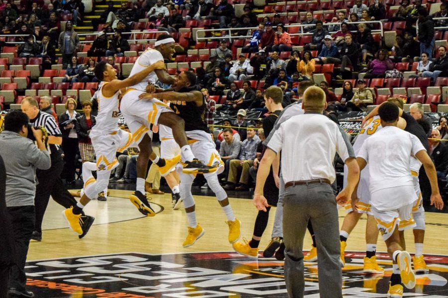 The NKU mens basketball team celebrates after winning the Horizon League championship.