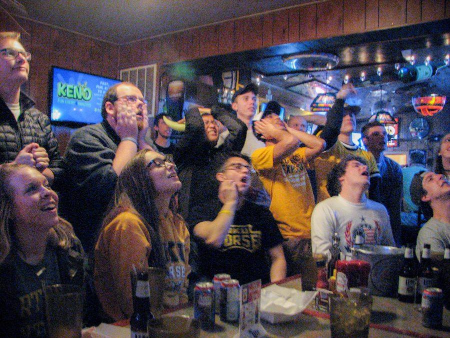 The crowd at Skyline Tavern rooted on the Norse against Milwaukee during the Horizon League tournament championship game.
