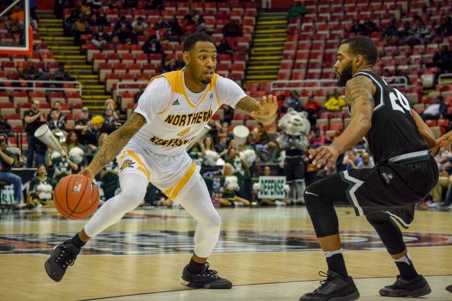 Jeff Garrett (4) goes around a defender during Sunday's Horizon League quarterfinal win over Wright State.