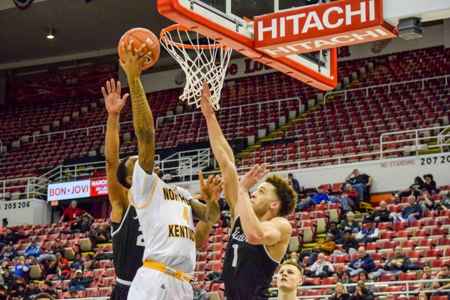 Jeff Garrett (4) gets his own rebound and scores during Sunday's Horizon League quarterfinal game against Wright State.