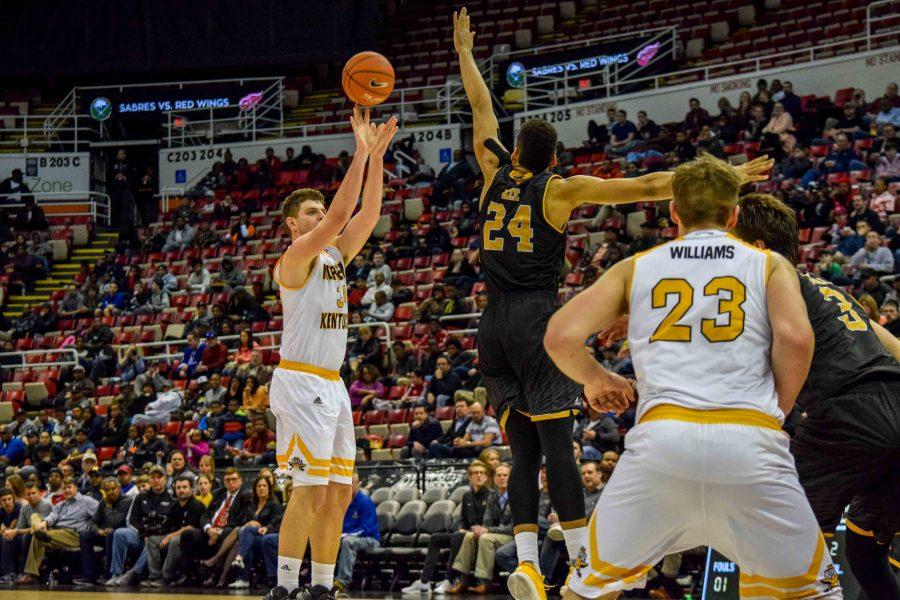 Drew McDonald (34) makes a three  during the Horizon League championship game against Milwaukee.