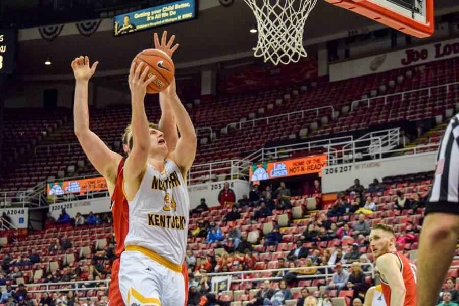 Drew McDonald (34) fights through contact during Mondays Horizon League semifinal win over Youngstown State.