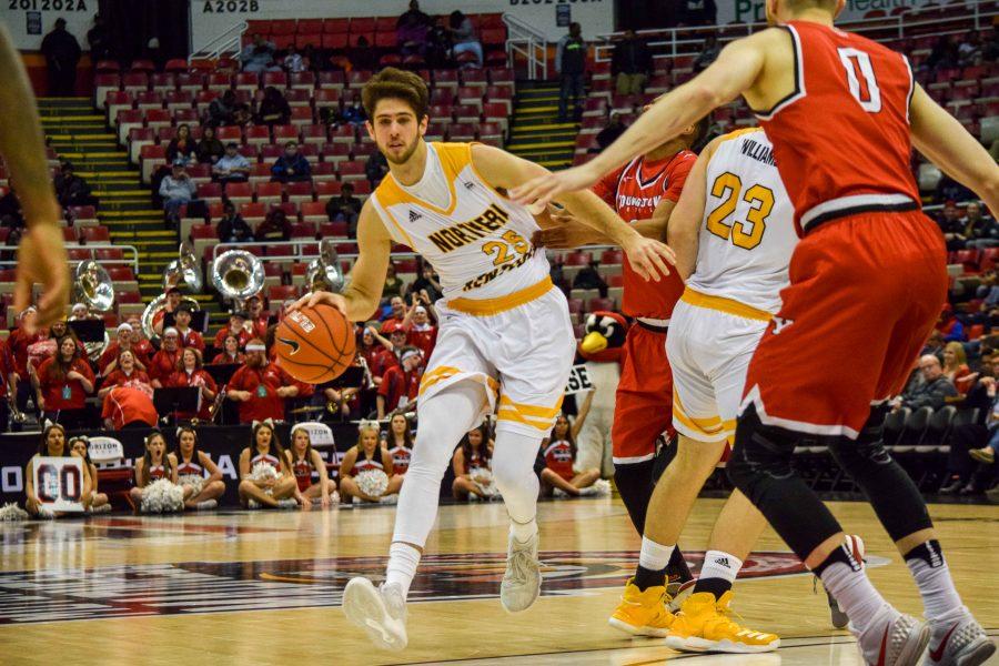 Cole Murray (25) is grabbed as he goes around defenders during Monday's Horizon League semifinal win over Youngstown State.