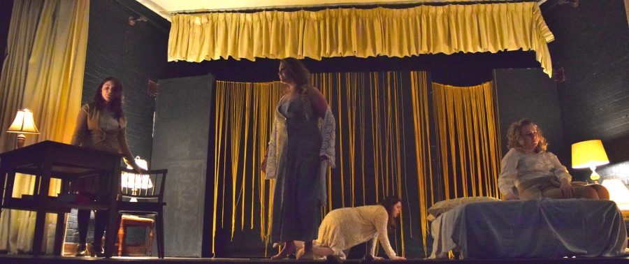 All four Janes fill the stage back-dropped by yellow. They rehearsed the last scene in the adapted The Yellow Wallpaper.