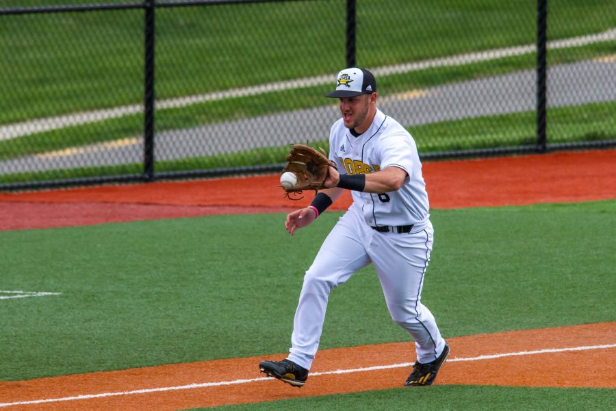 Chad Roberts fields a bouncing ball at third base for an out.