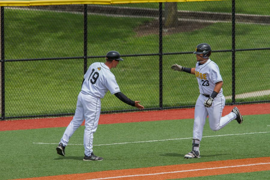 Trey Ganns rounds third base after he hit a home run.