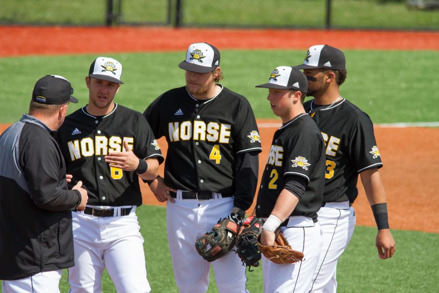 Brad Bohlen (6), Dominic Mercurio (4) Kyle Colletta (2) and Trey Ganns (23) talk to coach Todd Asalon during a pitching change