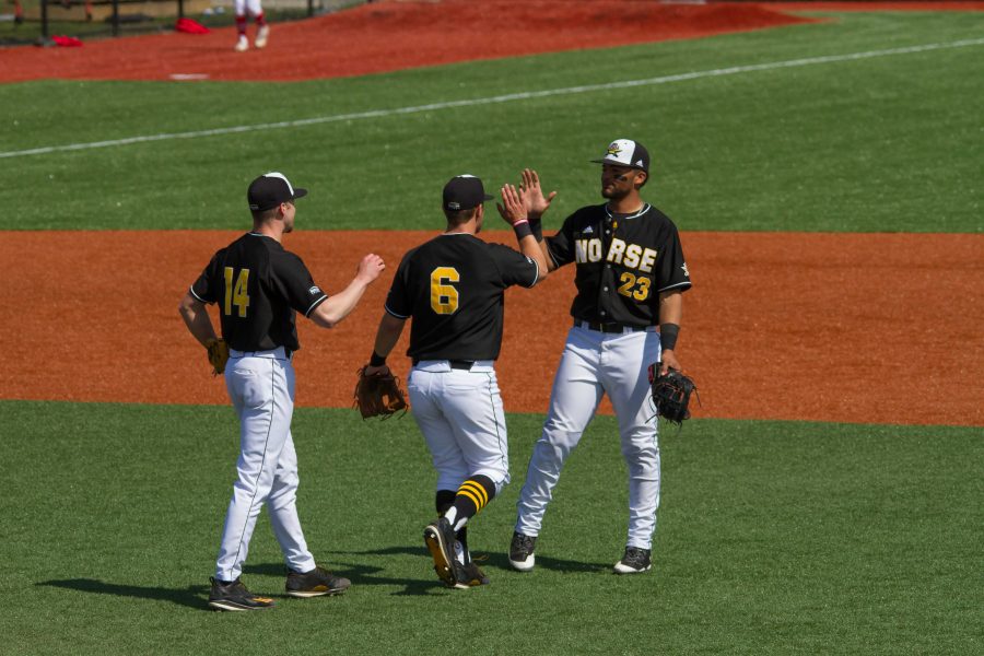 Cameron Ross (14), Brad Bohlen (6) and Trey Ganns (23) shake hands after Sunday's win over Youngstown State.