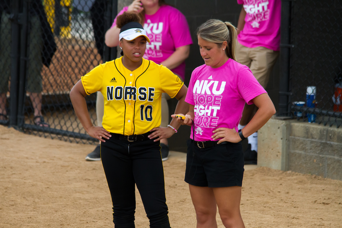 Morgan Glover (10) talks with assistant coach Shana Madura during Thursdays game against Green Bay. 