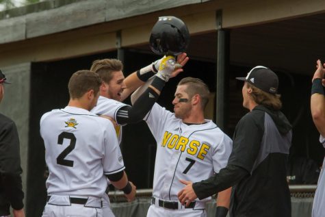 TJ Alas (7) celebrates Will Haueters homerun against Oakland