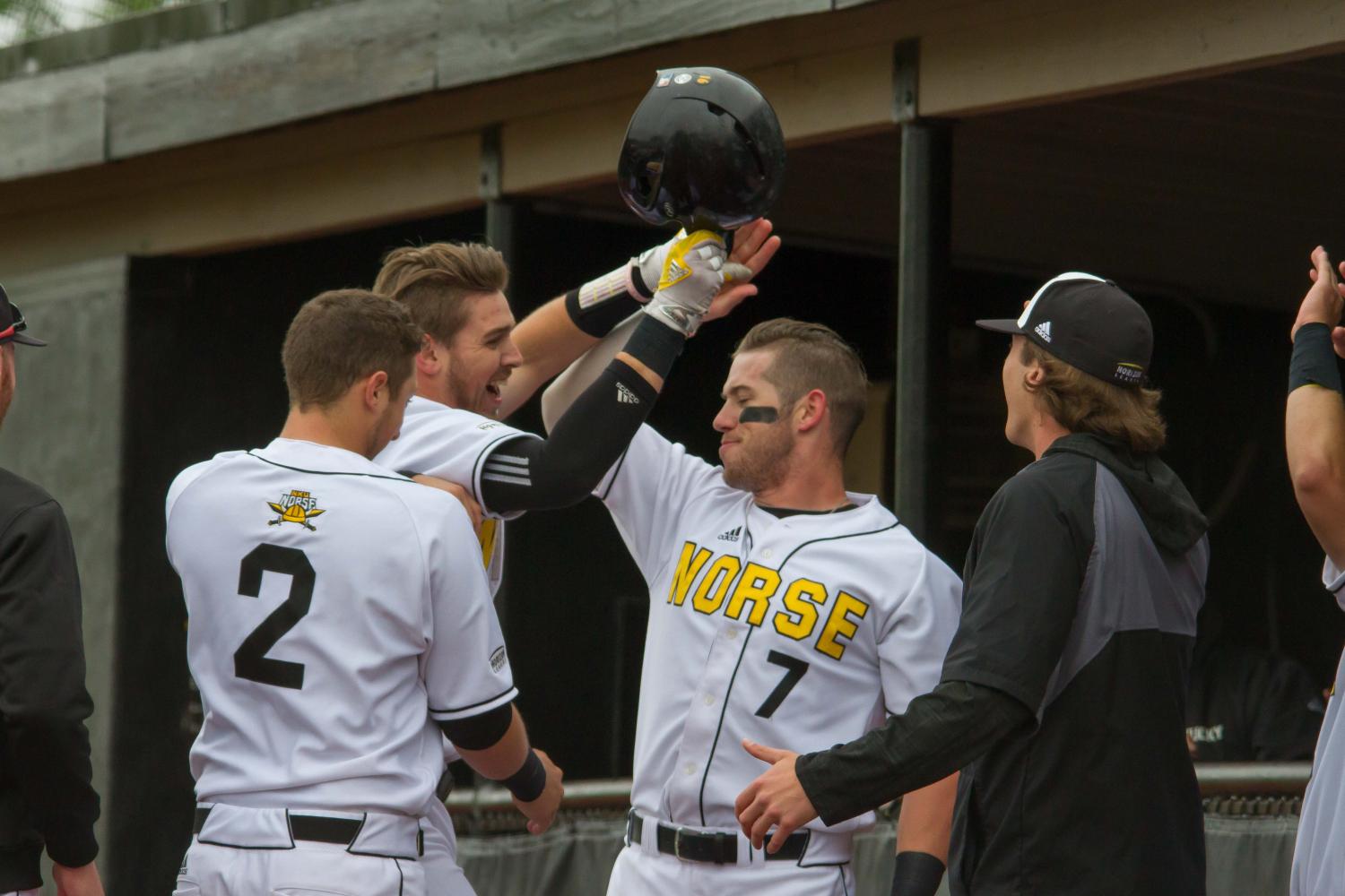 TJ Alas (7) celebrates Will Haueter's homerun against Oakland