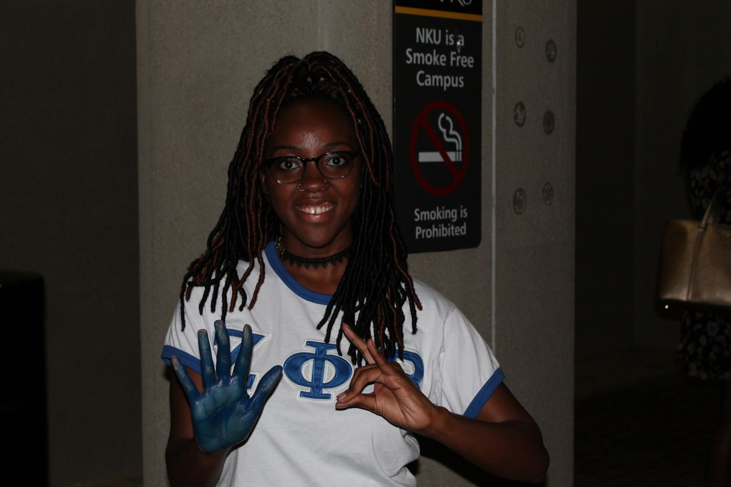 As the vigil ended, several attendees stayed after to paint their hands. 