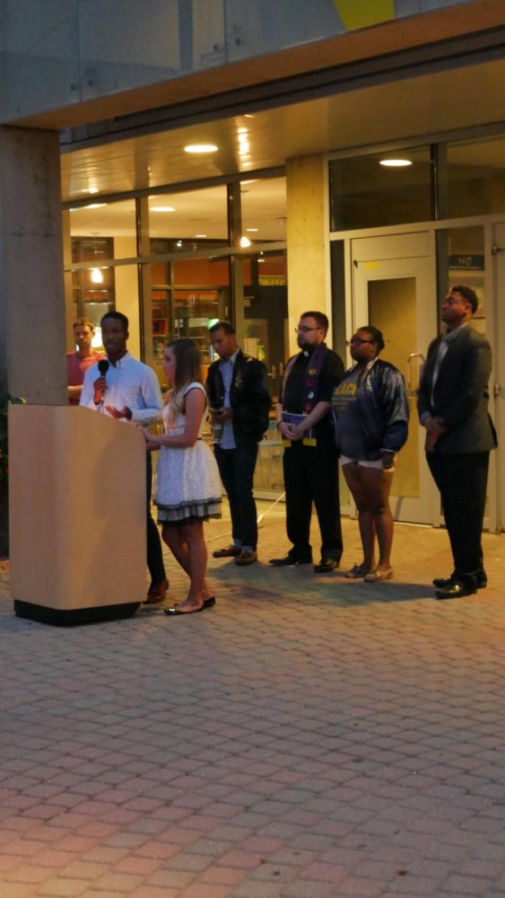 Speakers stood at a podium in the SU Plaza. SGA president Sami Dada and vice president Erica Bluford addressed a crowd upwards of 50. 