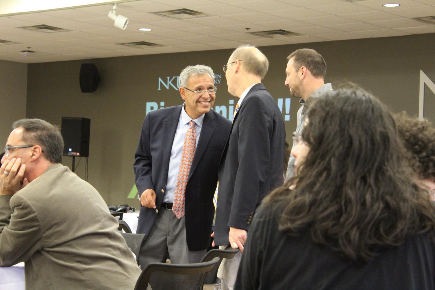 The director of Latino programs and Services mingled with attendees. 