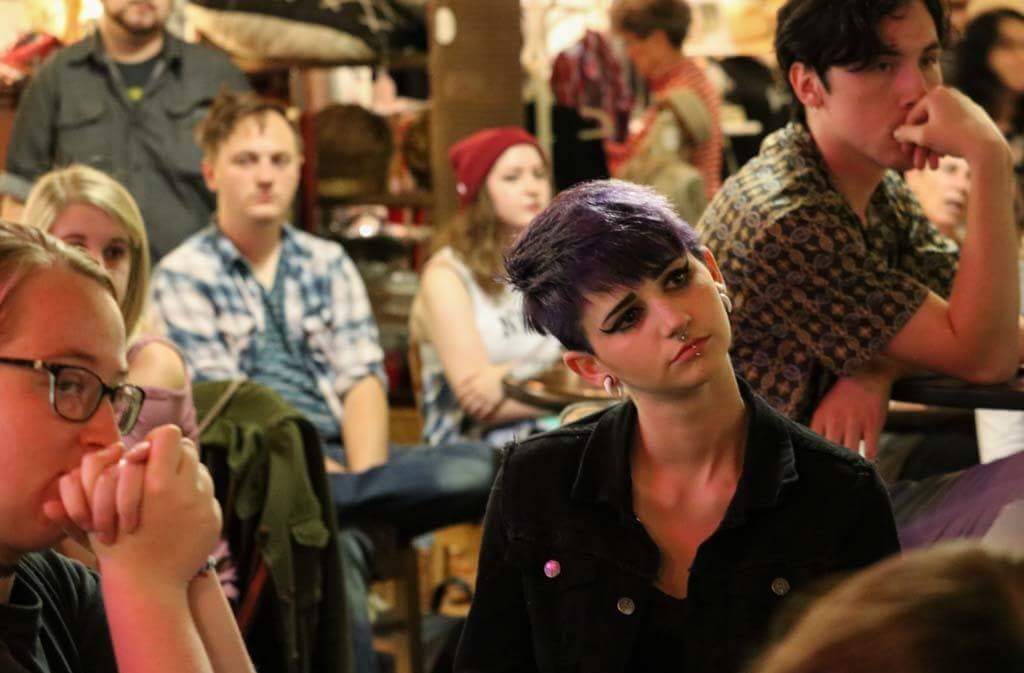 Audience members watch on as speakers take the stage at September's Loch Norse Magazine open mic night. 