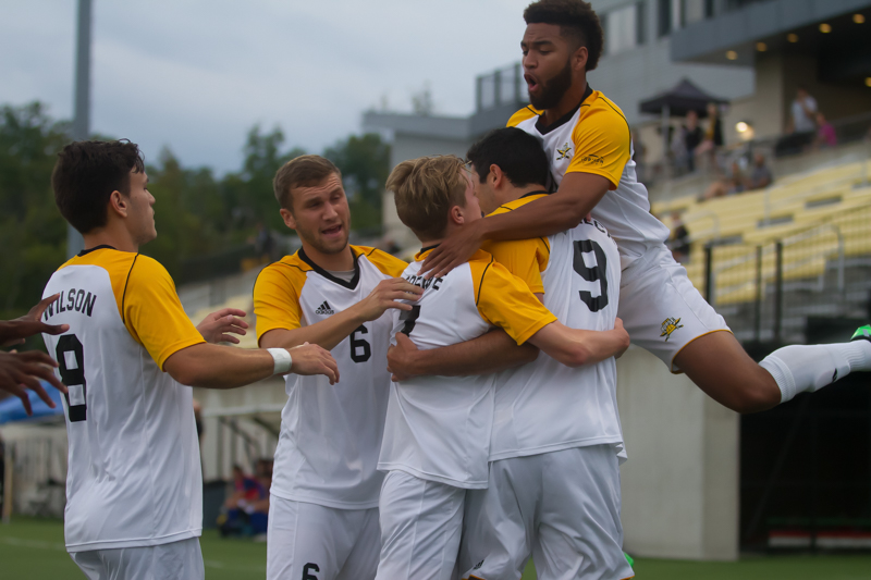 NKU players celebrate after a goal by Tom Suchecki (9)