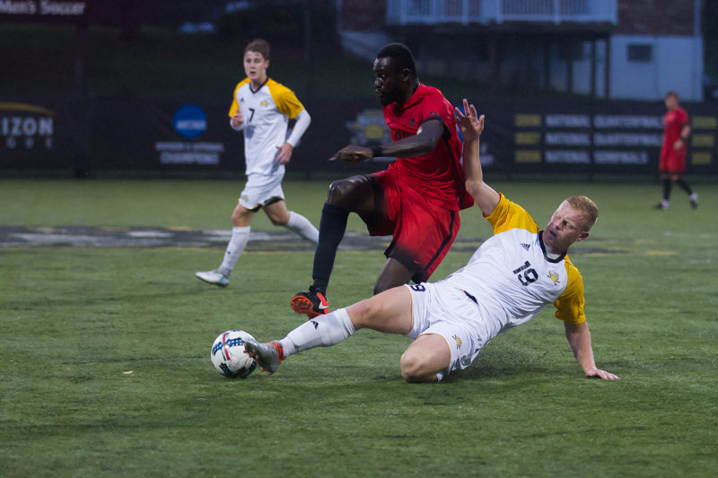 Harvey Moyes (19) steals the ball from a Dayton player