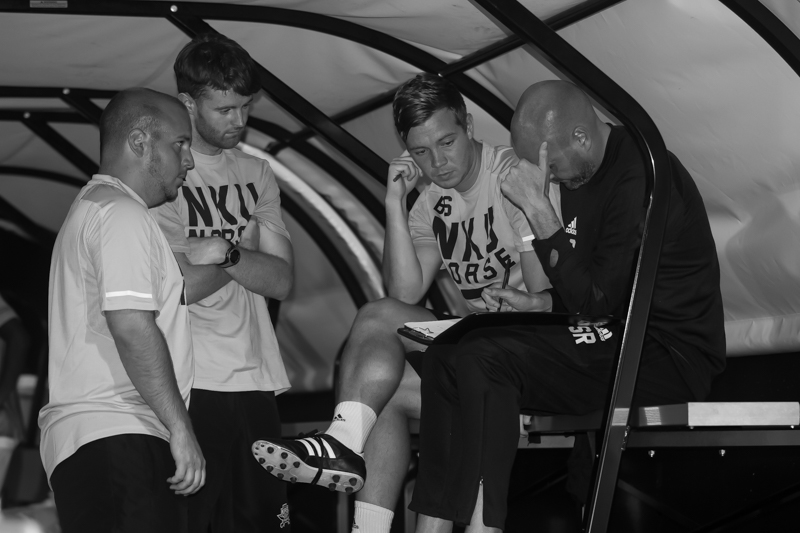 NKU Mens Soccer coaching staff plans before the first overtime period in the game against Marshall