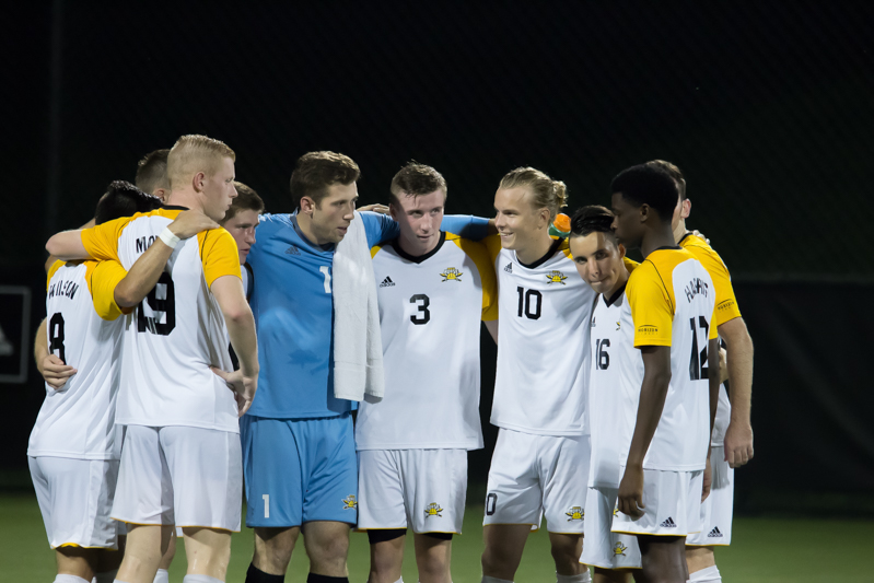 NKU players huddle up before the second half in the game against Marshall