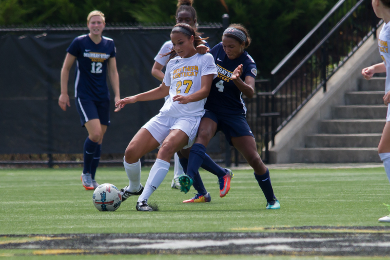 Samantha Duwel (27) prepares to pass the ball to a teammate