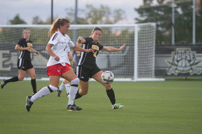 Hannah Fischer (4) defends against a UC player