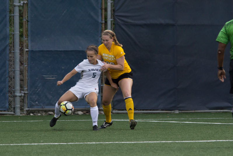 Taylor Spaulding (28) Defends against a Xavier player