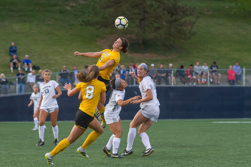 Macy Hamblin (3) wins a headball in the game against Xavier