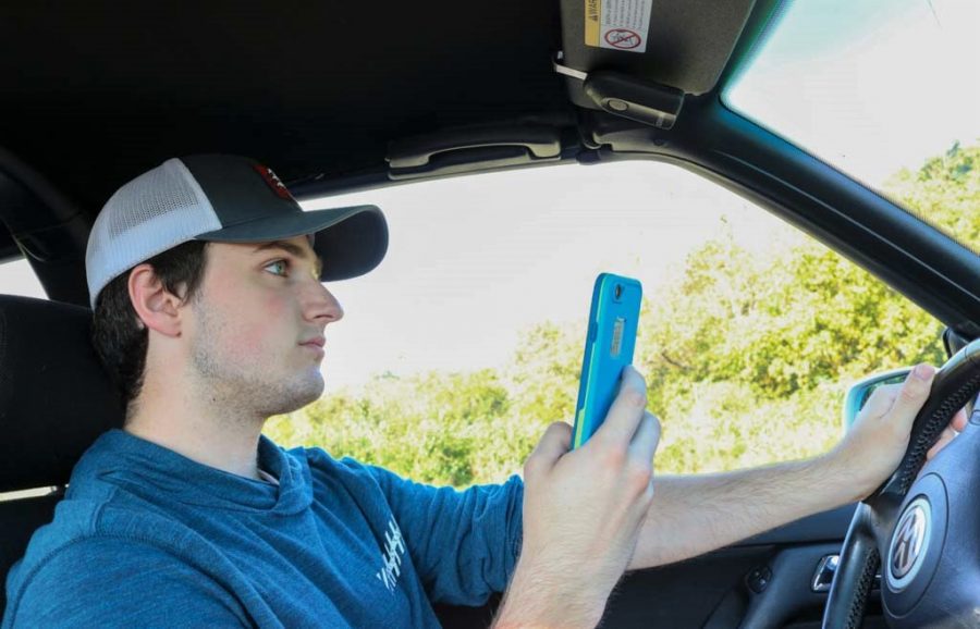 Young adults often split their attention between their phone and the road, creating potentially dangerous situations