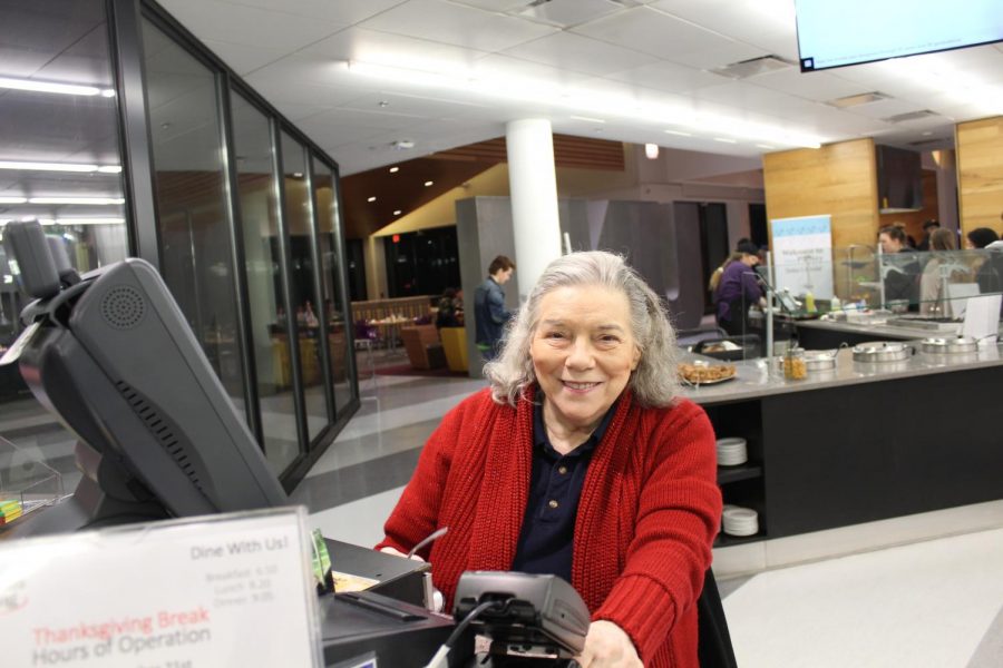 Kremer sits at her post waiting to check students into Norse Commons