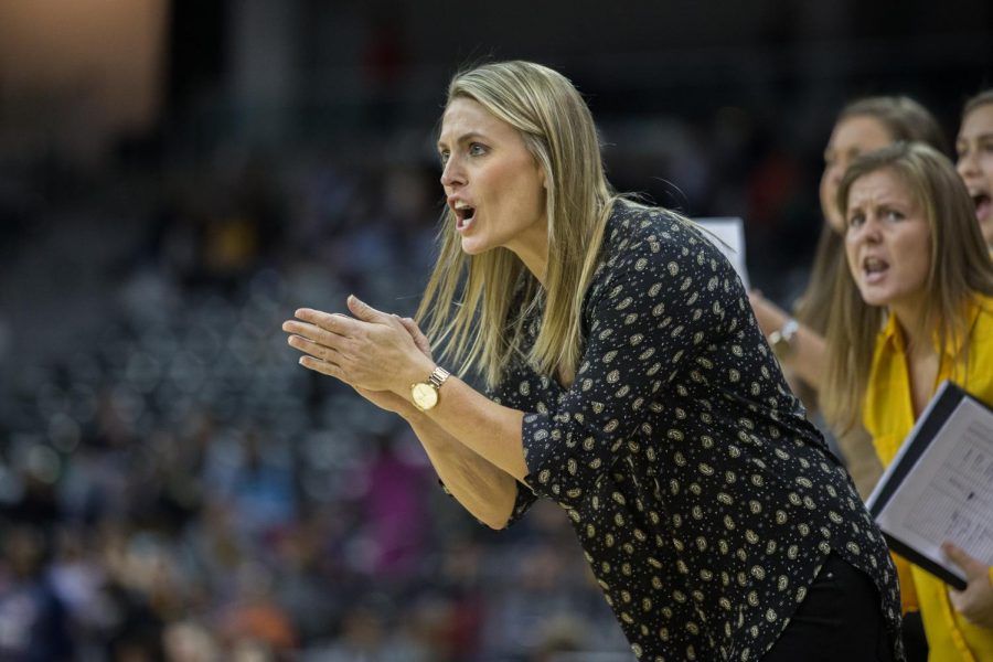 Head Coach Camryn Whitaker talks to her team during the game against Robert Morris