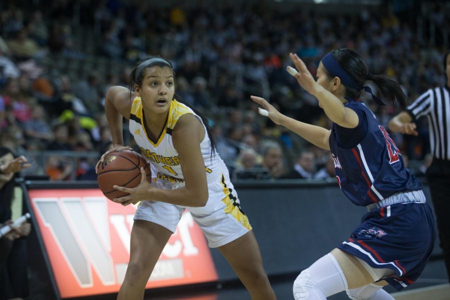 Grace White (1) looks for a teammate to pass to in the game against Robert Morris.