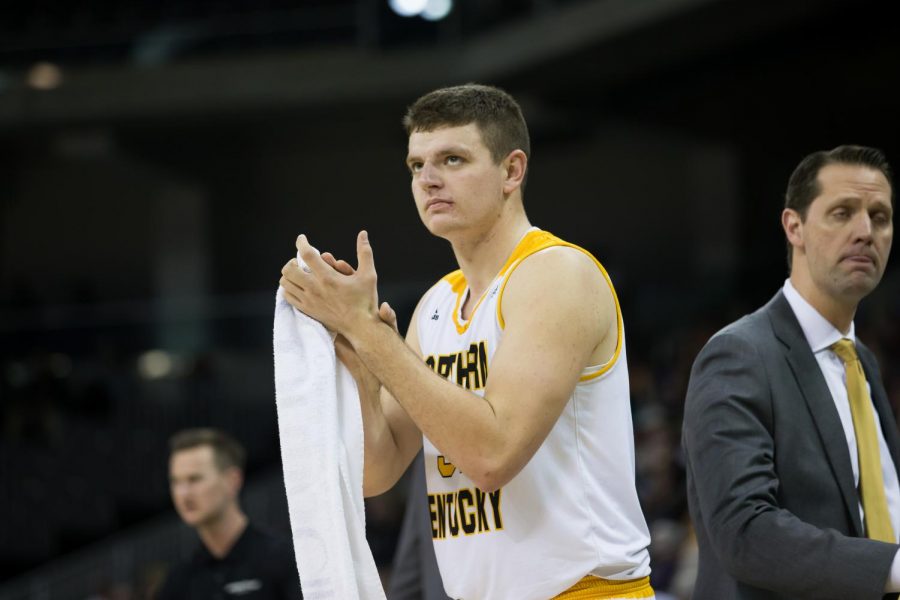 Drew McDonald (34) claps after a score by NKU.