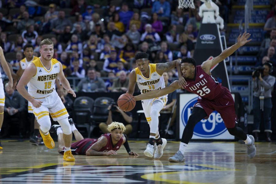 Mason Faulkner (11) steals the ball in the game against IUPUI.