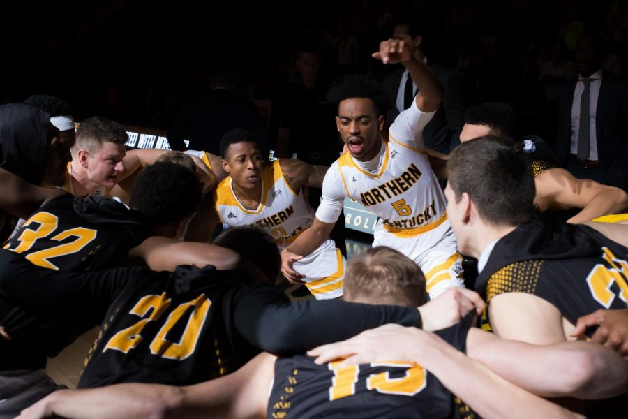 Jalen Tate (5) talks in the huddle before the home game against IUPUI.