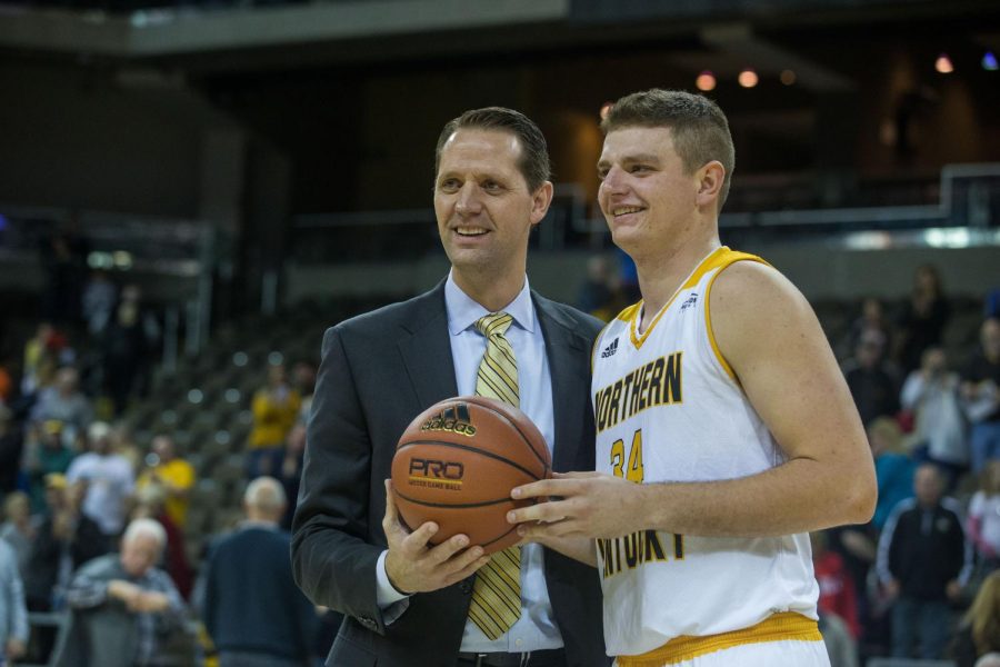 Head Coach John Brannen congratulates Drew McDonald (34) on his 1000th career point in the game against Morehead. 