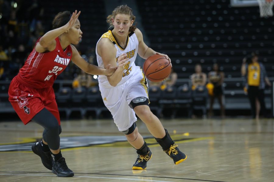 Molly Glick (24) drives toward the basket in the game against  Austin Peay.