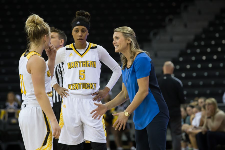 Taryn Taugher (11) and Samari Mowbray (5) talk to Head Coach Camryn Whitaker during the game against Green Bay, Dec. 30, 2017.