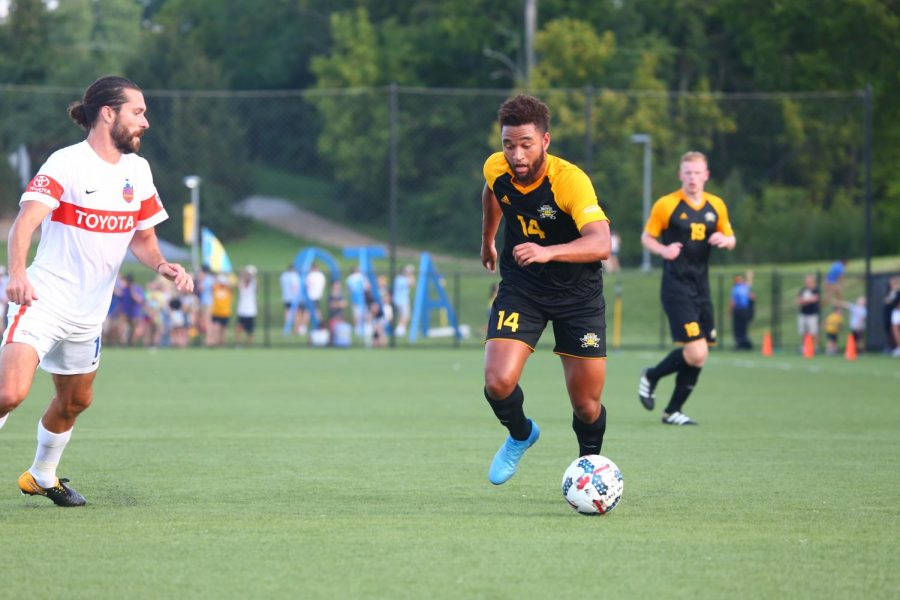 Abdul Kooistra dribbles past an defender during their match with the FC Cincinnati reserve team in August