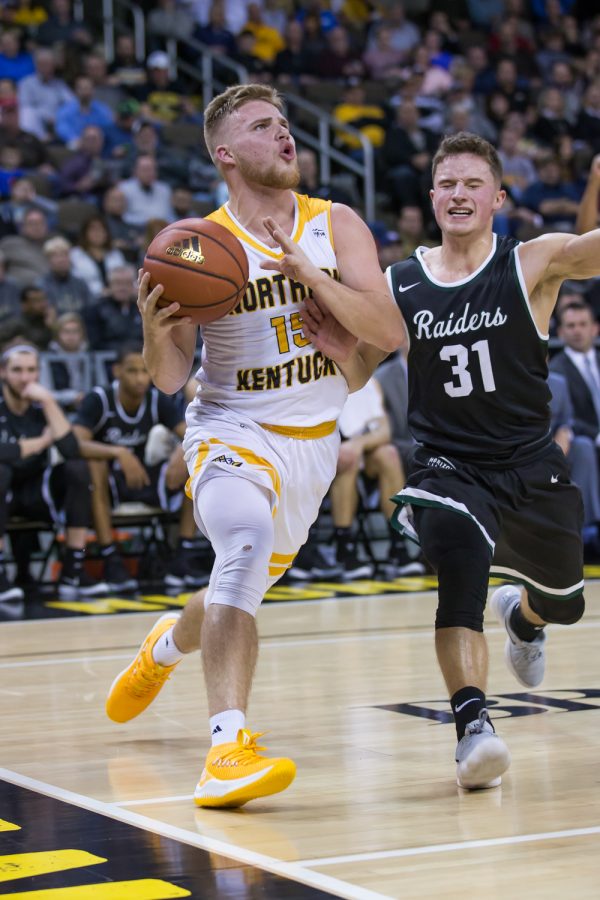 Tyler Sharpe (15) drives toward the basket in the game against Wright State.