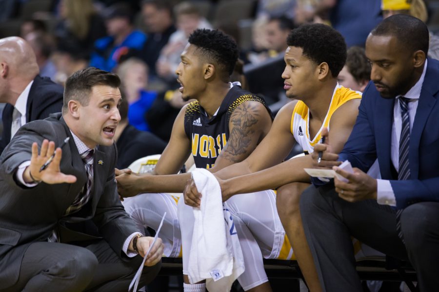 An NKU coach talks to Dantez Walton (32) during the game against Wright State.