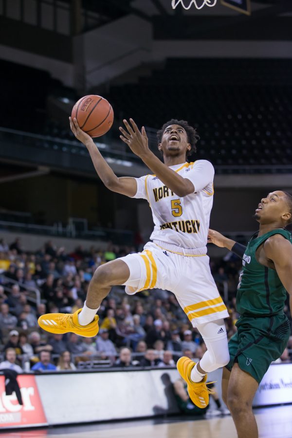 Jalen Tate (5) goes up to shoot in the game against Cleveland State.