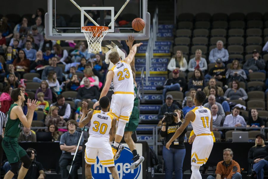 Carson Williams (23) blocks a Cleveland State players shot.