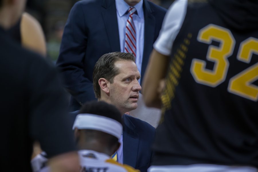 Head Coach John Brannen talks to his team during a timeout in the game against Cleveland State.
