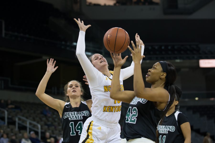 Jazmyne Geist (13) loses the ball as she goes up for a shot in the game against Cleveland State.