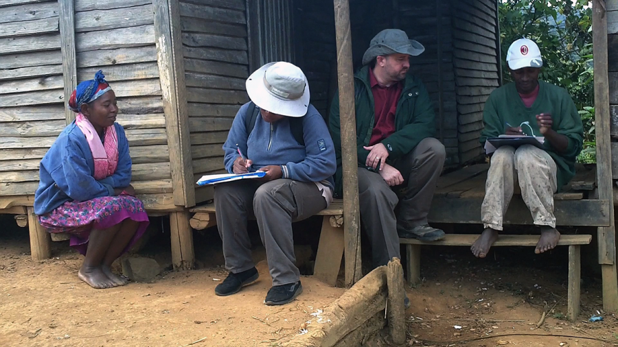 Professor Douglas Hume with his research assistants in Mahatsara, Madagascar, in summer 2012; they were conducting an ethnographic interview with an informant (not pictured). 

