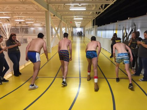 Nearly naked runners prepare to race.