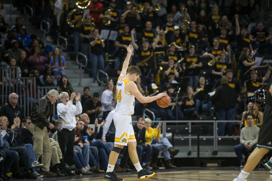 Drew McDonald (34) cheers on the crowd as time expires in the game against Green Bay.