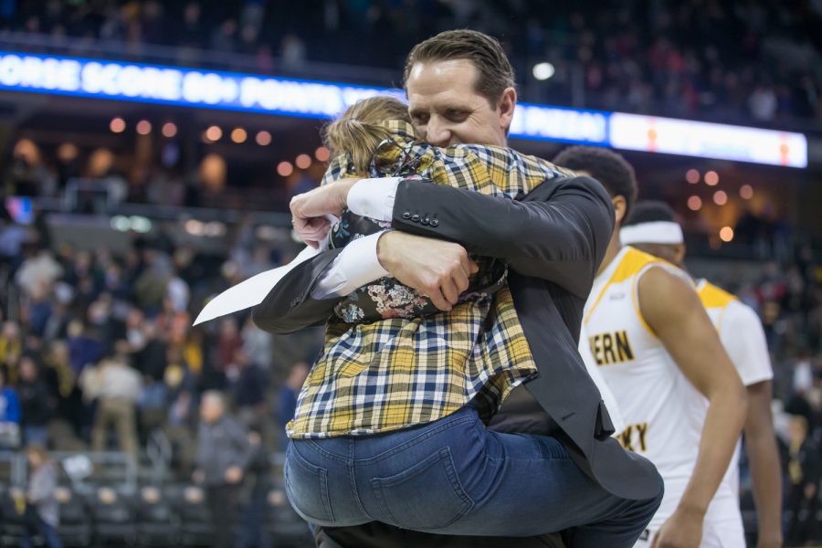 Head coach John Brannen celebrates the Norse win with one of his daughters.