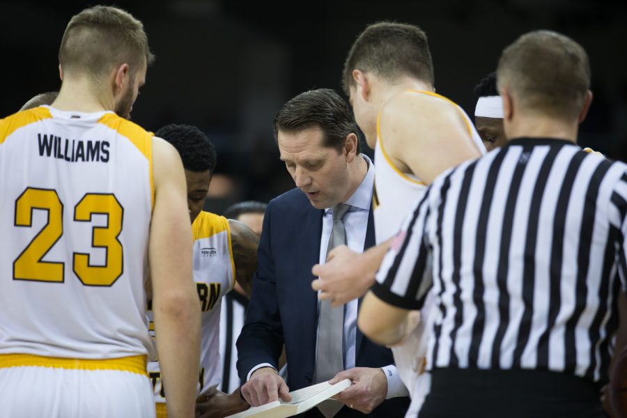 Head Coach John Brannen goes over a play during a timeout in the game against Milwaukee.